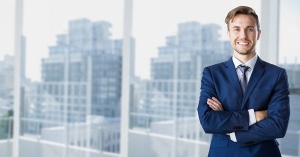 Candaian Visa Professionals - Businessman standing with arms crossed